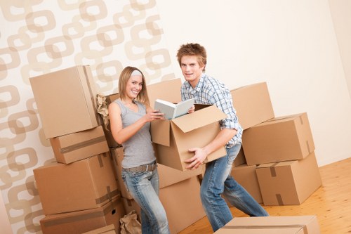 Organized secure storage unit in Chelsea with packed boxes and furniture