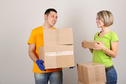 Movers handling fragile belongings during a Chelsea flat removal